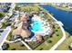 Community pool area with expansive deck and surrounding landscape at 2436 Chateau Loop, Kissimmee, FL 34741