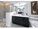 Bathroom boasts a large vanity, soaking tub, and walk-in shower at 2436 Chateau Loop, Kissimmee, FL 34741