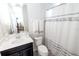 Clean bathroom with dark vanity and shower/tub combo at 2436 Chateau Loop, Kissimmee, FL 34741