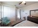 Bedroom with a teal accent chair and built-in closet at 2436 Chateau Loop, Kissimmee, FL 34741