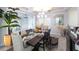 Elegant dining room features a dark wood table, stylish decor, and plenty of natural light at 2436 Chateau Loop, Kissimmee, FL 34741
