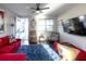 Open living area with comfortable seating and large TV at 2436 Chateau Loop, Kissimmee, FL 34741
