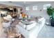 Spacious living room showcases a comfy sectional sofa and an open floor plan at 2436 Chateau Loop, Kissimmee, FL 34741