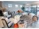 Spacious living room featuring ample seating and large windows at 2436 Chateau Loop, Kissimmee, FL 34741