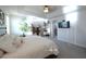 Bright and airy main bedroom with a large bed and ensuite bathroom access at 2436 Chateau Loop, Kissimmee, FL 34741