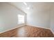 Spacious bedroom with laminate wood flooring and ceiling fan at 2294 Trailwinds Ter, The Villages, FL 32162