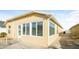 Rear view of a house featuring a large window and patio at 2294 Trailwinds Ter, The Villages, FL 32162