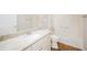 Clean bathroom with granite countertop, single sink, and bathtub at 2294 Trailwinds Ter, The Villages, FL 32162