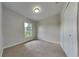 Bright bedroom with carpet flooring and a large window at 1646 Center St, Deland, FL 32720
