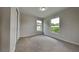 Spacious bedroom featuring new carpet and ample natural light at 1646 Center St, Deland, FL 32720