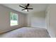 Well-lit bedroom with carpet flooring and ceiling fan at 1646 Center St, Deland, FL 32720