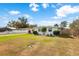 Front view of a white single-story house with a well-maintained lawn at 1685 Kissengen Ave, Bartow, FL 33830