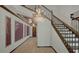 Elegant staircase with chandelier and ornate railings at 8447 Chilton Dr, Orlando, FL 32836