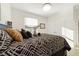 Main bedroom with a queen bed and neutral color scheme at 1360 Se 63Rd Court Rd, Ocala, FL 34472