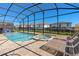 Enjoy this screened-in pool and spa at 1829 Caribbean View Ter, Kissimmee, FL 34747