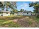 Large backyard with shed, mature trees, and grassy areas at 2302 Broadway St, Lakeland, FL 33801