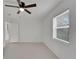 Bright bedroom with ceiling fan, window blinds, and tile floor at 2302 Broadway St, Lakeland, FL 33801