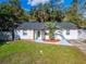 Newly renovated home with a palm tree and landscaped yard at 2302 Broadway St, Lakeland, FL 33801