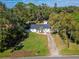 Aerial view of a house with a driveway and yard at 2302 Broadway St, Lakeland, FL 33801