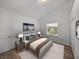 Well-lit bedroom with double closets and wood flooring at 716 W 14Th St, Lakeland, FL 33805