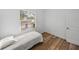 Small bedroom with a single bed and closet, featuring wood flooring at 716 W 14Th St, Lakeland, FL 33805