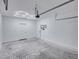 Spacious garage with overhead door and hexagon lighting at 716 W 14Th St, Lakeland, FL 33805