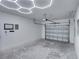 Garage with overhead door and hexagon lighting at 716 W 14Th St, Lakeland, FL 33805