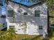 Rear view of a modern house showcasing its white siding and landscaping at 716 W 14Th St, Lakeland, FL 33805