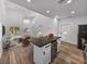 Open concept kitchen features island with wine fridge, stainless steel appliances and living room view at 716 W 14Th St, Lakeland, FL 33805