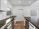 Modern kitchen with stainless steel appliances and dark countertops at 716 W 14Th St, Lakeland, FL 33805