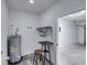 Laundry room with water heater and garage access at 716 W 14Th St, Lakeland, FL 33805