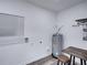 Laundry room with water heater and folding table at 716 W 14Th St, Lakeland, FL 33805
