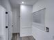 Bright laundry room with vinyl flooring, a window, and extra storage at 716 W 14Th St, Lakeland, FL 33805