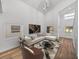 Modern living room with L-shaped sofa, coffee table, and high ceilings at 716 W 14Th St, Lakeland, FL 33805