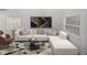 Modern living room with L-shaped sofa, coffee table, and large artwork at 716 W 14Th St, Lakeland, FL 33805