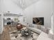 Open-concept living room and kitchen with modern furniture and high ceilings at 716 W 14Th St, Lakeland, FL 33805