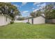Backyard view showcasing detached shed at 132 James St, Auburndale, FL 33823