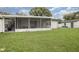 Large backyard with screened porch and detached shed at 132 James St, Auburndale, FL 33823