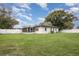 House exterior and expansive grassy backyard at 132 James St, Auburndale, FL 33823