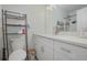 Clean bathroom with white vanity, a shower, and a toilet at 132 James St, Auburndale, FL 33823
