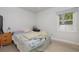 Bright bedroom with light gray walls and wood-look flooring at 132 James St, Auburndale, FL 33823