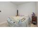 Small bedroom with light gray walls and wood-look flooring at 132 James St, Auburndale, FL 33823