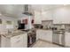 Modern kitchen with granite countertops, stainless steel appliances, and white cabinetry at 132 James St, Auburndale, FL 33823