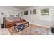 Living room featuring a brown couch and coffee table at 132 James St, Auburndale, FL 33823