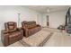 Spacious living area with recliner seating and carpet at 132 James St, Auburndale, FL 33823