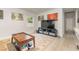 Cozy living room with a large TV and comfy furniture at 132 James St, Auburndale, FL 33823