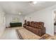 Open living area with a large sectional sofa and rug at 132 James St, Auburndale, FL 33823