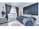 Stylish bedroom with guitar, amp and periodic table decor at 6867 Shadowcast Ln, Lakeland, FL 33813
