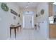 Spacious entryway with tile floors and farmhouse decor at 6867 Shadowcast Ln, Lakeland, FL 33813
