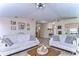 Open living room with two comfy sofas and views into the kitchen at 6867 Shadowcast Ln, Lakeland, FL 33813